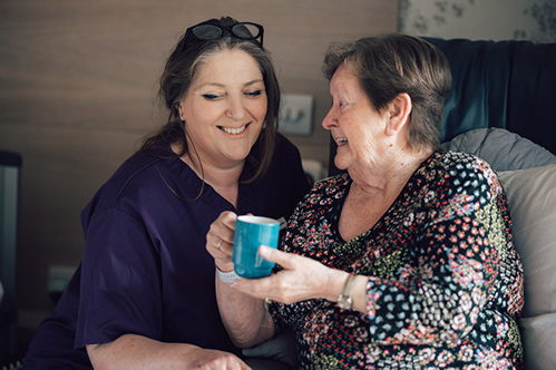 Health care assistant with a patient
