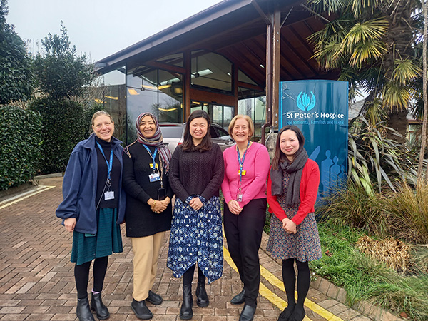 Visitors from the Chinese Wellbeing Association with St Peter's Hospice staff